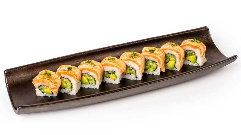Avocado & cucumber wrapped in nori and rice, topped with gently seared salmon, chives, spicy mayo & sweet-salty unagi sauce.