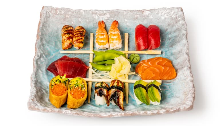 2 Shake Yaki Salmon Nigiri, 2 Tuna Nigiri, 2 Ebi Nigiri, 2 Eel Nigiri, 2 Avocado Nigiri, 2 Inari Nigiri, 3 Salmon Sashimi & 3 Tuna Sashimi.